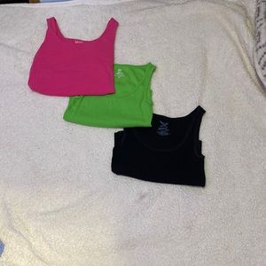 These are 3 different tank tops they come in the color pink green and black